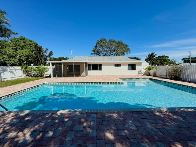 view of pool featuring a sunroom