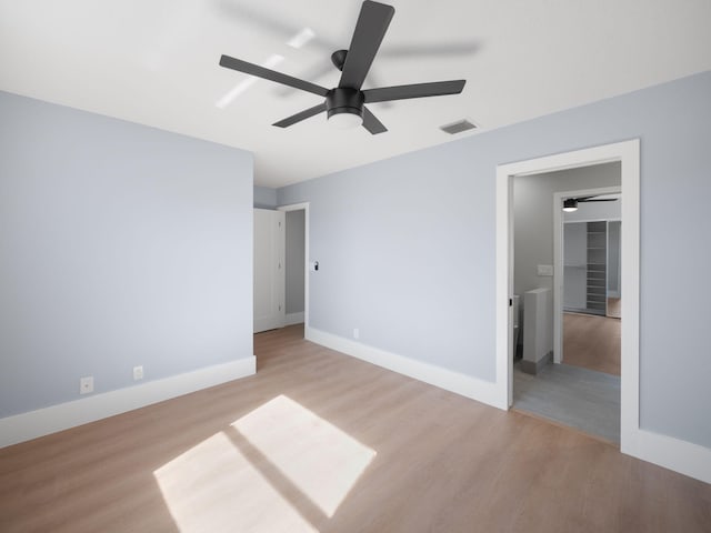 unfurnished bedroom featuring ceiling fan and light hardwood / wood-style flooring