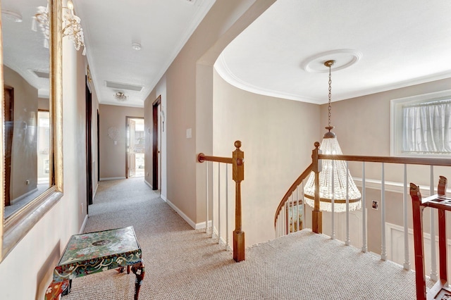 hallway featuring light colored carpet and ornamental molding