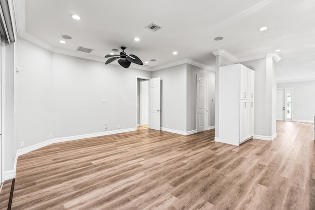 unfurnished room with ceiling fan, light hardwood / wood-style floors, and crown molding