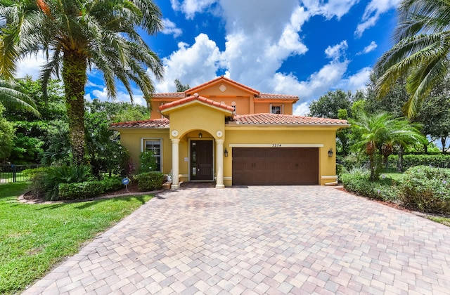 mediterranean / spanish house featuring a garage