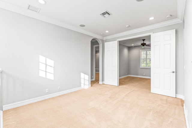 unfurnished bedroom with light colored carpet and ornamental molding