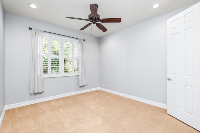 carpeted empty room with ceiling fan