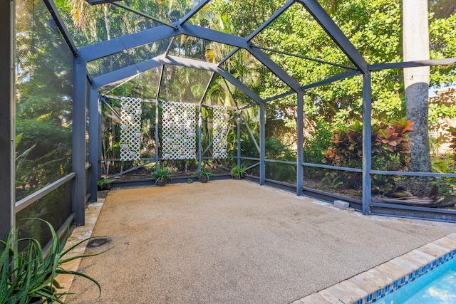 unfurnished sunroom featuring lofted ceiling