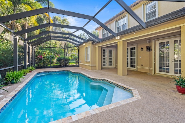 view of swimming pool featuring a patio area, a lanai, and french doors