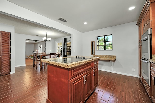 kitchen featuring visible vents, baseboards, wood tiled floor, black electric stovetop, and recessed lighting