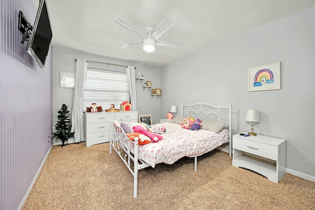 bedroom featuring ceiling fan, baseboards, and light colored carpet