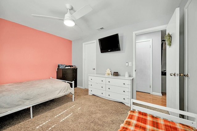 bedroom with ceiling fan, visible vents, and baseboards