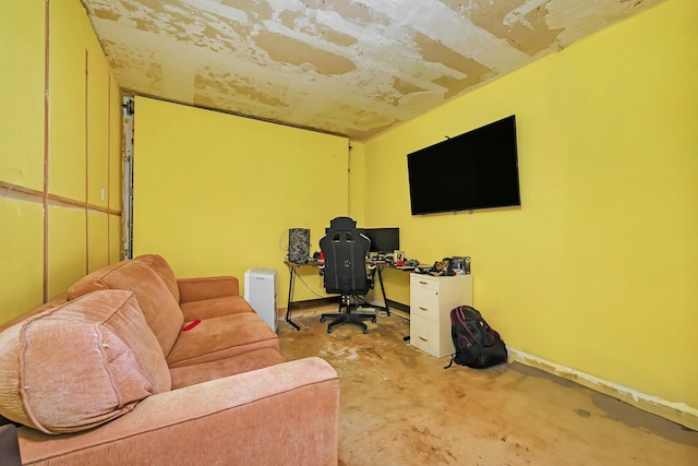 living area featuring concrete floors