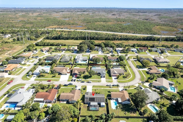 birds eye view of property with a residential view