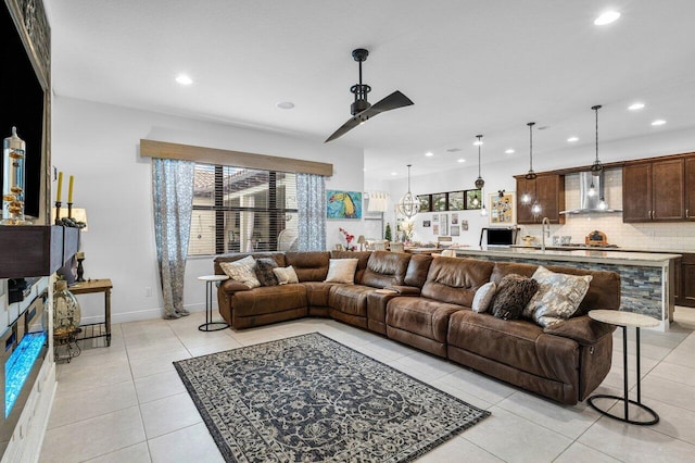 tiled living room with sink and ceiling fan