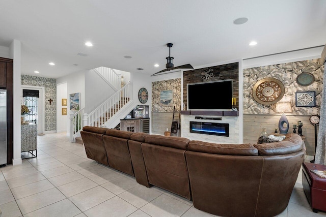 tiled living room featuring ceiling fan