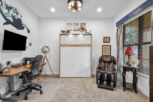 office area featuring light carpet