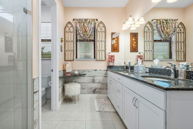 bathroom with tile patterned floors, toilet, and vanity