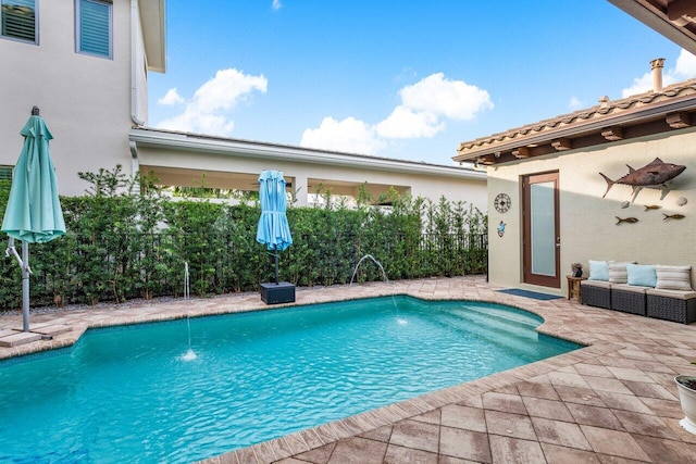 view of swimming pool featuring a patio and pool water feature