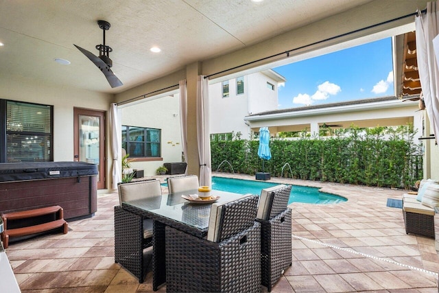 exterior space with pool water feature, ceiling fan, a hot tub, and a patio