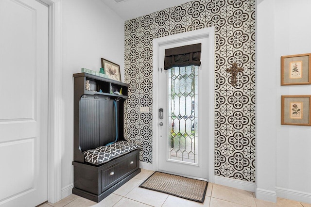 mudroom featuring a healthy amount of sunlight and light tile patterned floors