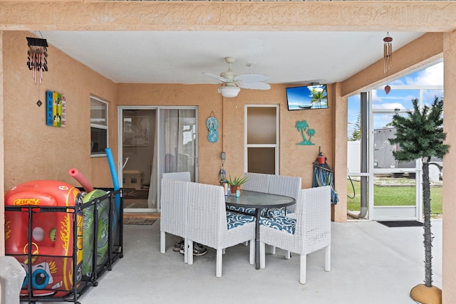 sunroom / solarium with ceiling fan