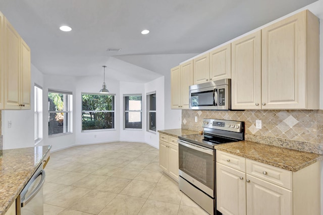 kitchen featuring light stone countertops, tasteful backsplash, stainless steel appliances, hanging light fixtures, and lofted ceiling