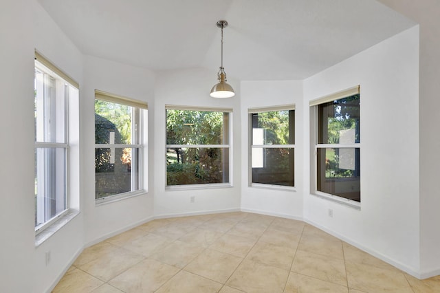 unfurnished sunroom with vaulted ceiling and a wealth of natural light