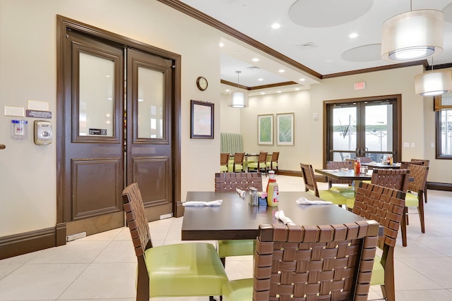 tiled dining area featuring french doors and ornamental molding