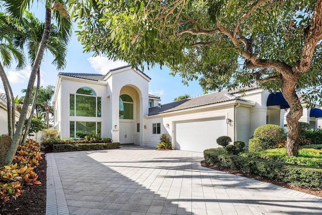 mediterranean / spanish-style home featuring a garage