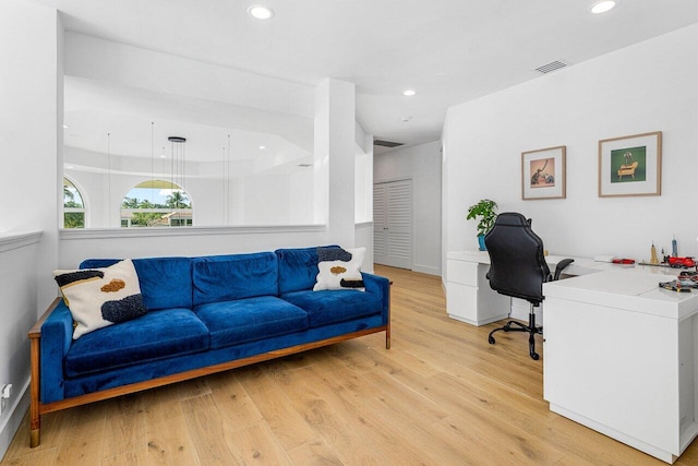 office with light hardwood / wood-style flooring