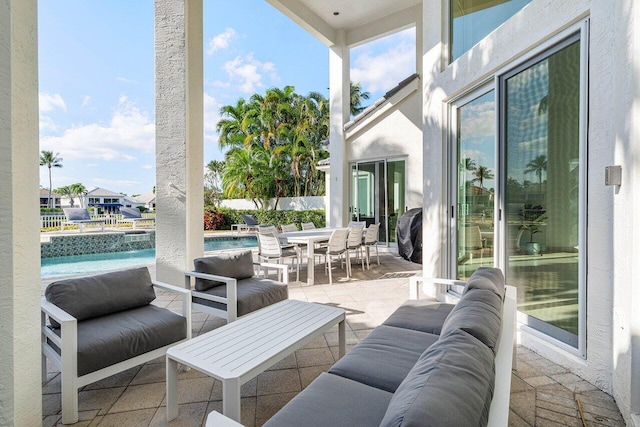 view of patio / terrace with a fenced in pool and an outdoor hangout area