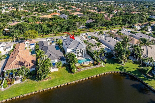 birds eye view of property featuring a water view