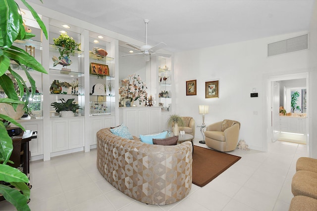 tiled living room featuring ceiling fan