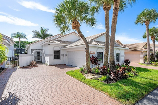 mediterranean / spanish-style house featuring a garage