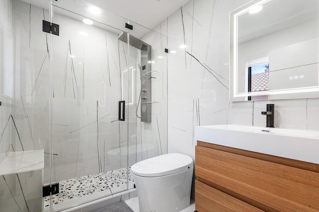 bathroom with tasteful backsplash, an enclosed shower, vanity, tile walls, and toilet