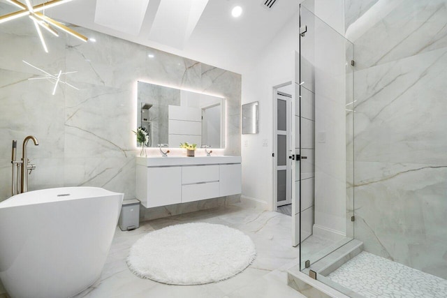 bathroom featuring vanity, shower with separate bathtub, and tile walls