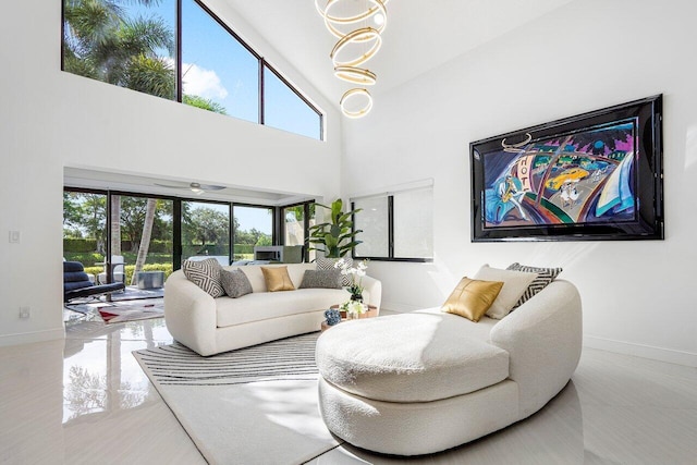 living room with tile patterned flooring and a high ceiling