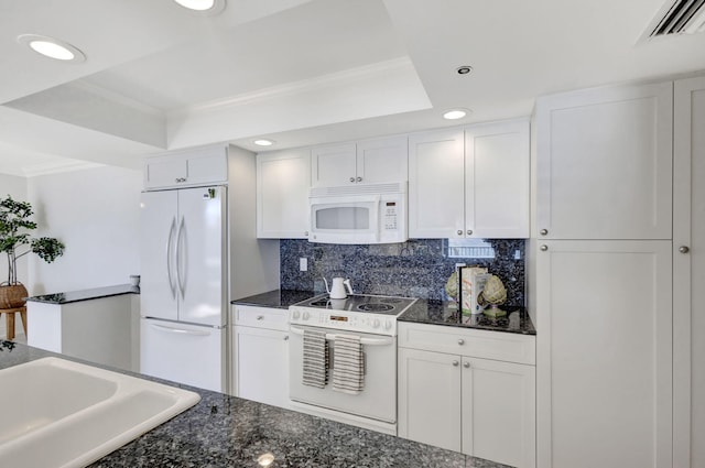 kitchen with sink, white cabinetry, tasteful backsplash, a raised ceiling, and white appliances