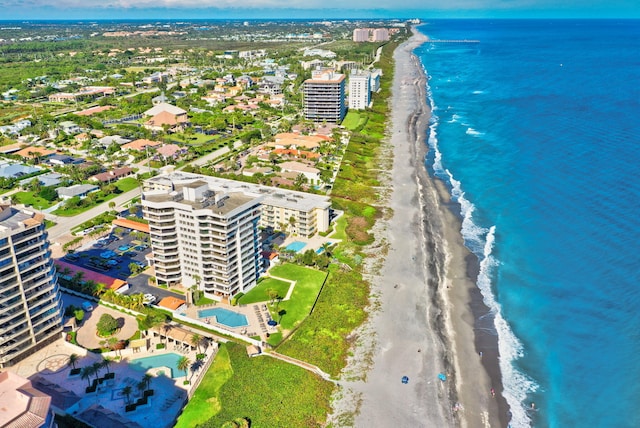 drone / aerial view featuring a view of the beach and a water view