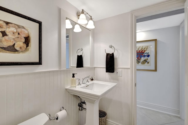 bathroom with tile patterned floors