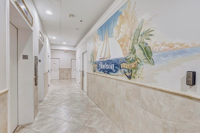 hall with light tile patterned flooring and elevator