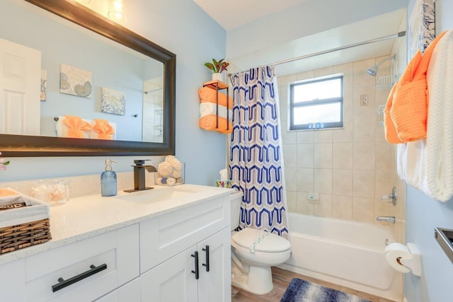 full bathroom with shower / bath combo with shower curtain, vanity, wood-type flooring, and toilet