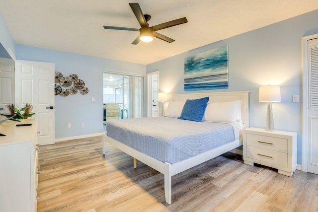 bedroom with ceiling fan and light hardwood / wood-style flooring