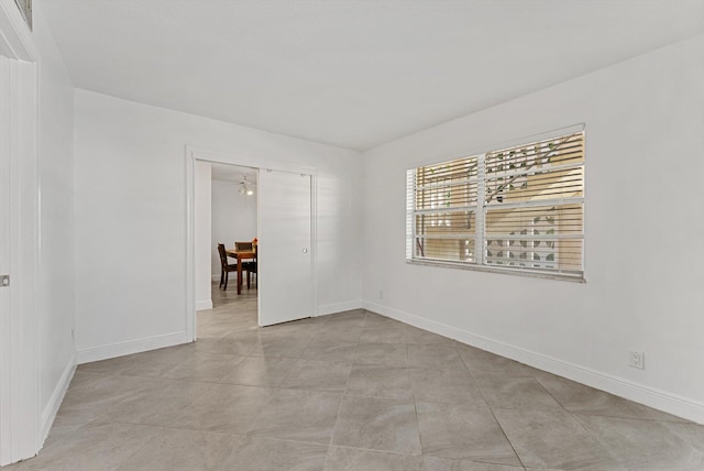 unfurnished room with ceiling fan