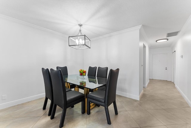 dining space with light tile patterned floors, a textured ceiling, ornamental molding, and a notable chandelier