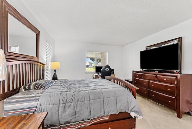 bedroom with light tile patterned floors and a textured ceiling