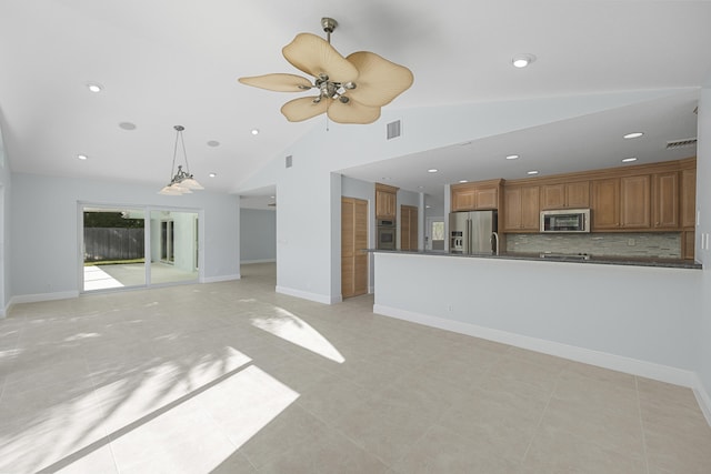 unfurnished living room with ceiling fan, light tile patterned floors, and vaulted ceiling