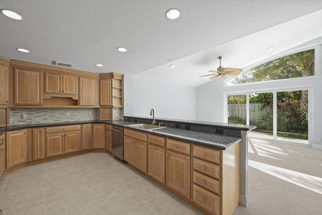 kitchen with dishwasher, kitchen peninsula, vaulted ceiling, and sink