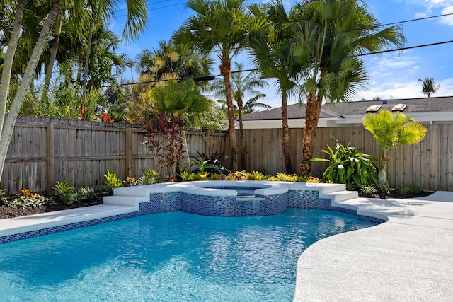 view of swimming pool featuring an in ground hot tub