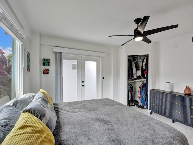 bedroom with ceiling fan, a closet, and french doors