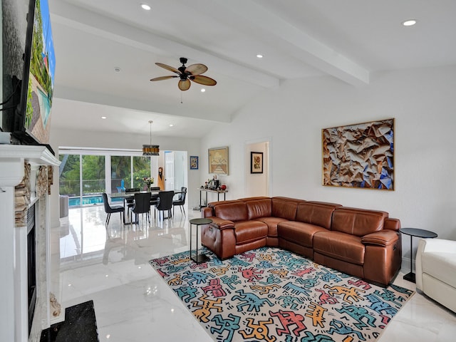 living room featuring vaulted ceiling with beams, ceiling fan, and a premium fireplace