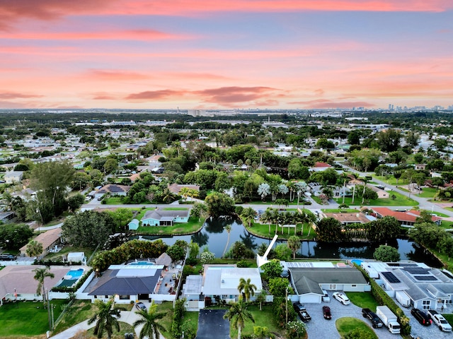 aerial view at dusk with a water view