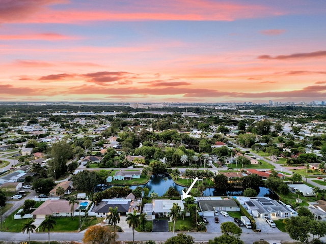 aerial view at dusk with a water view